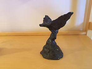 Black Bird II — dark sculpture of a bird with raised wings