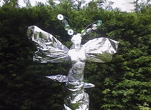 Winged Figure — wire sculpture with translucent wings